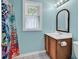 Bright bathroom with colorful shower curtain and modern sink at 715 9Th Ave. S, Surfside Beach, SC 29575