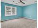 Bedroom with neutral carpet, large window, and a ceiling fan at 715 9Th Ave. S, Surfside Beach, SC 29575