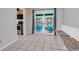 Bright dining area featuring tile floors, bench seating and sliding door access to a screened porch at 715 9Th Ave. S, Surfside Beach, SC 29575