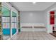 Bright dining area featuring tile floors, bench seating and sliding door access to a screened porch at 715 9Th Ave. S, Surfside Beach, SC 29575