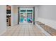 Bright dining area featuring tile floors, bench seating and sliding door access to a screened porch at 715 9Th Ave. S, Surfside Beach, SC 29575