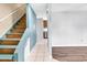 Hallway featuring tile flooring and wooden stairs with painted risers in a home interior at 715 9Th Ave. S, Surfside Beach, SC 29575