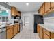 Updated kitchen features stainless appliances, white countertops, tile backsplash and ample cabinetry at 715 9Th Ave. S, Surfside Beach, SC 29575