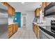 Updated kitchen features stainless appliances, white countertops, tile backsplash and ample cabinetry at 715 9Th Ave. S, Surfside Beach, SC 29575