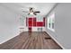 View of a bright living room with wood flooring, a ceiling fan, and built-in shelving at 715 9Th Ave. S, Surfside Beach, SC 29575