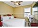 Cozy bedroom with a ceiling fan, bright window, and dark dresser at 755 Burcale Rd. # D6, Myrtle Beach, SC 29579