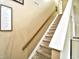 Carpeted staircase with a wooden handrail and inspirational decor at 755 Burcale Rd. # D6, Myrtle Beach, SC 29579