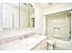 Bright bathroom with a single sink vanity, mirror, and a shower-tub combo at 816 Kittiwake Ln., Murrells Inlet, SC 29576