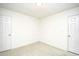Empty bedroom featuring neutral carpet, white walls, and two doors at 816 Kittiwake Ln., Murrells Inlet, SC 29576