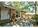 Inviting outdoor patio area with brick accents and lush greenery at 816 Kittiwake Ln., Murrells Inlet, SC 29576