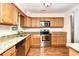 Well-equipped kitchen featuring stainless steel appliances and ample cabinet space at 816 Kittiwake Ln., Murrells Inlet, SC 29576