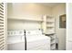 Well-lit laundry room features a washer, dryer, built-in shelving, and a cream-painted color scheme at 816 Kittiwake Ln., Murrells Inlet, SC 29576