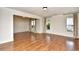 Bright and airy living room with large windows and hardwood floors at 816 Kittiwake Ln., Murrells Inlet, SC 29576