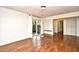 Living room with hardwood floors and sliding doors to outdoor patio at 816 Kittiwake Ln., Murrells Inlet, SC 29576