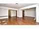 Open-concept living area showcasing hardwood floors and built-in shelving at 816 Kittiwake Ln., Murrells Inlet, SC 29576