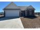 Charming single-story home with a two-car garage and well-maintained landscaping at 926 Padgett Lane, Conway, SC 29526