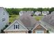 Aerial view of a neighborhood with homes boasting beautiful exteriors and well-manicured lawns at 932 Mildred Ct., Murrells Inlet, SC 29576