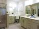 Bright bathroom featuring double vanity, granite countertops, makeup vanity, and tiled shower enclosure at 932 Mildred Ct., Murrells Inlet, SC 29576