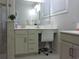 Bathroom features a makeup vanity with a comfortable chair, tile floors, and tiled shower enclosure at 932 Mildred Ct., Murrells Inlet, SC 29576
