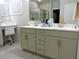 Bathroom featuring double vanity with granite countertops, a tiled shower enclosure, and tiled floors at 932 Mildred Ct., Murrells Inlet, SC 29576