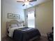 Bedroom with a decorative ceiling fan, queen sized bed, and window with decorative blinds at 932 Mildred Ct., Murrells Inlet, SC 29576