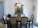 Formal dining room with a wooden table set, elegant lighting, and stylish decor at 932 Mildred Ct., Murrells Inlet, SC 29576
