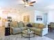 Open-concept living room featuring a large sectional sofa and view into the kitchen at 932 Mildred Ct., Murrells Inlet, SC 29576