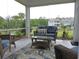 Relaxing screened porch with comfortable seating and views of the surrounding landscape at 932 Mildred Ct., Murrells Inlet, SC 29576