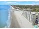 Expansive aerial view of condo complex with beach access and oceanfront views at 9400 Shore Dr. # 523, Myrtle Beach, SC 29572