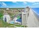 Captivating aerial view of a beachfront complex with tennis court, pool, and ocean access at 9400 Shore Dr. # 523, Myrtle Beach, SC 29572