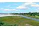 Breathtaking aerial view of a serene coastline featuring marshland, oceanfront homes, and a sandy beach at 9400 Shore Dr. # 523, Myrtle Beach, SC 29572