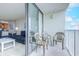 Comfortable balcony with chairs, perfect for enjoying ocean views from the living area at 9400 Shore Dr. # 523, Myrtle Beach, SC 29572