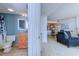 View of a bathroom leading to a living room and kitchen with wood floors at 9400 Shore Dr. # 523, Myrtle Beach, SC 29572
