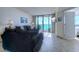 Comfortable living room with a sliding glass door to the patio with ocean view at 9400 Shore Dr. # 523, Myrtle Beach, SC 29572