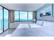 Bright bedroom with large windows offering ocean views and access to the balcony at 9400 Shore Dr. # 523, Myrtle Beach, SC 29572