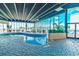 Bright indoor pool area with ample seating and panoramic views of the surrounding landscape at 9400 Shore Dr. # 523, Myrtle Beach, SC 29572