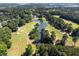 Scenic aerial of golf course and surrounding woodlands, showing green fairways, water features at 9569 Indigo Club Dr., Murrells Inlet, SC 29576