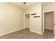 Bedroom with vaulted ceiling, wood-look flooring, and a closet, offering a cozy retreat at 9569 Indigo Club Dr., Murrells Inlet, SC 29576