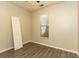 Bedroom with attractive wood-look flooring and a window, creating a relaxing atmosphere at 9569 Indigo Club Dr., Murrells Inlet, SC 29576