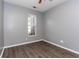 Bedroom with gray walls, laminate flooring, and a bright window at 9569 Indigo Club Dr., Murrells Inlet, SC 29576