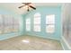 Light-filled flex room with tile floors, high ceilings and three large windows at 9569 Indigo Club Dr., Murrells Inlet, SC 29576
