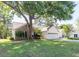 Well-maintained exterior with brick and siding, a mature shade tree, and attached garage at 9569 Indigo Club Dr., Murrells Inlet, SC 29576