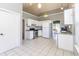 Bright kitchen features white cabinets, tile backsplash, and stainless steel appliances at 9569 Indigo Club Dr., Murrells Inlet, SC 29576