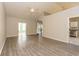 Inviting living room with vaulted ceiling, neutral tones, and wood-look floors at 9569 Indigo Club Dr., Murrells Inlet, SC 29576