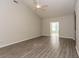 Spacious living room boasts vaulted ceilings, neutral tones, and stylish wood-look flooring at 9569 Indigo Club Dr., Murrells Inlet, SC 29576
