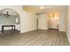 Open living room features vaulted ceilings, neutral walls, and light wood-look flooring at 9569 Indigo Club Dr., Murrells Inlet, SC 29576