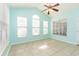 Bright and airy living room with abundant windows and tile flooring, filled with natural light at 9569 Indigo Club Dr., Murrells Inlet, SC 29576