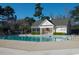 Community pool with a charming pool house and plenty of space for lounging around the pool at 9569 Indigo Club Dr., Murrells Inlet, SC 29576