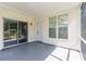 Charming screened porch with door, sliding glass door, and lots of natural light at 9569 Indigo Club Dr., Murrells Inlet, SC 29576