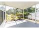 A screened porch with views of lush greenery, offering a peaceful outdoor space at 9569 Indigo Club Dr., Murrells Inlet, SC 29576
